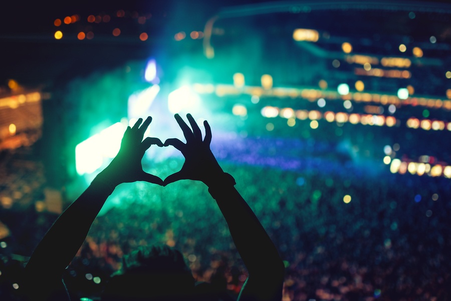 bigstock-Heart-Shaped-Hands-At-Concert--115331909.jpg
